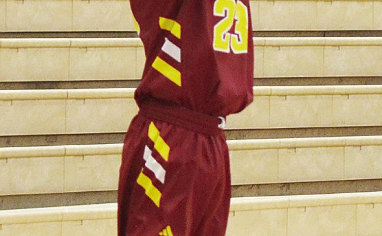 Clinton’s Joseph Nava shoots a three-pointer in the Reds’ JV game against Weatherford. CDN | Sam Goodwyn