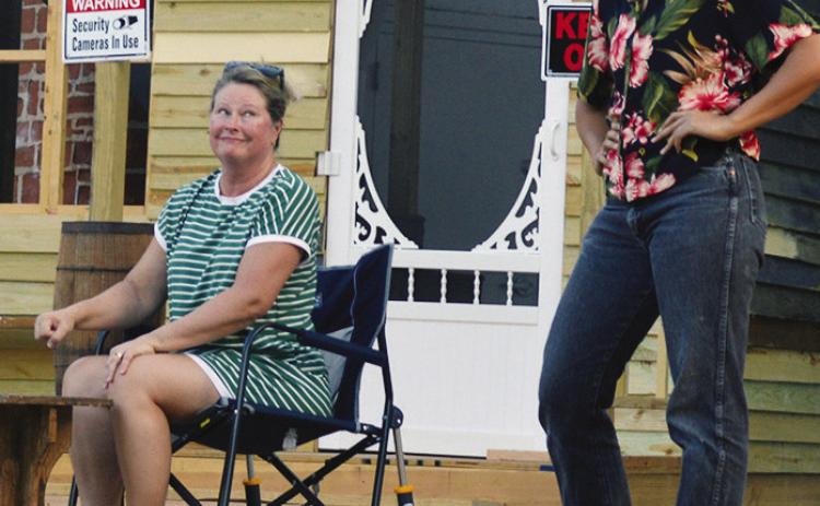 Julie Williams as Aunt Eller, left, and Angela Nichols as Laurey work on the beginning scenes of the musical “Oklahoma!” at the McLain Rogers Park Amphitheater. CDN | Christian Jacobsen