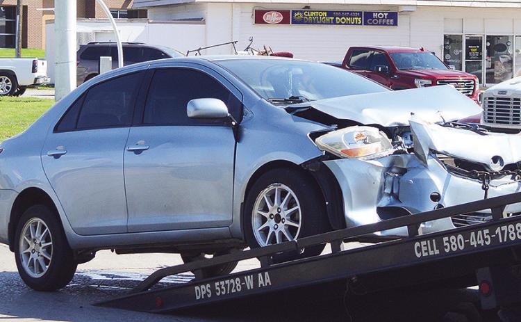 A wrecker pulls up a car after being involved in a two-vehicle collision at approximately 3 p.m. Tuesday at the intersection of Gary Boulevard and Modelle Avenue. It appeared no one was seriously injured. CDN | Micah Ashcraft