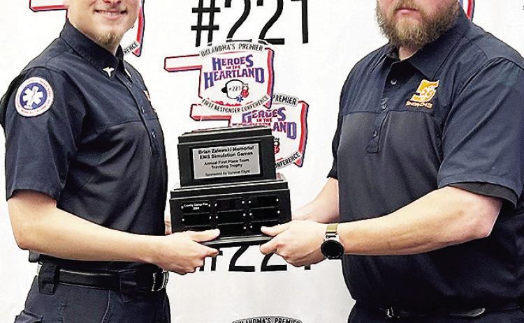 Grant Spillman, left, and James Livingston with Sinor EMS hold their trophy after getting first overall at the SIM Games held at the OKC Convention Center. CDN | Courtesy photo