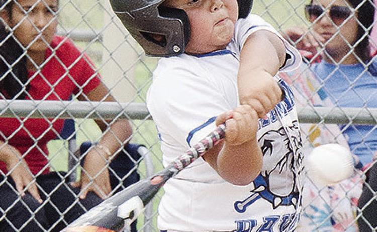 Damian Puentes of the Altus Diamond Dawgs swings mightily at the ball during the first game of the OK Kids 8U Baseball State Tournament Thursday at Schumacher Fields at Acme Brick Park. CDN | Sam Goodwyn