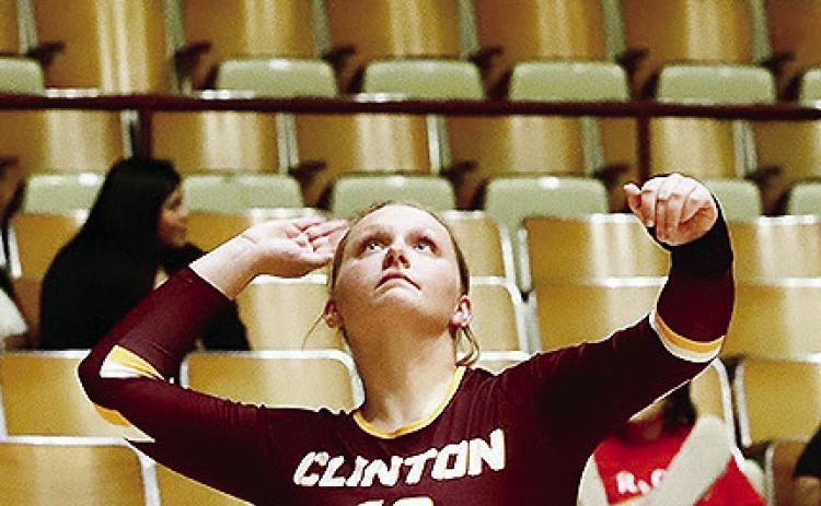 Clinton’s Sami Hammans focuses on the ball as she prepares to serve it during the Lady Reds’ Senior Night match against Blair. CDN |Kerri Staggs
