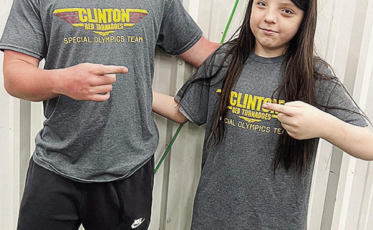 Gavin Evans, left, and RJ Brown smile after competing at the Area Special Olympics Unified Bocce Ball Tournament Friday at Clinton High School. CDN |Courtesy Photo