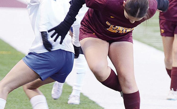 Clinton’s Aliyah Lopez, right, steals the ball from the Southeast player during the Lady Reds’ season-opening win Tuesday over the Lady Spartans in the Tornado Bowl. CDN | Sam Goodwyn