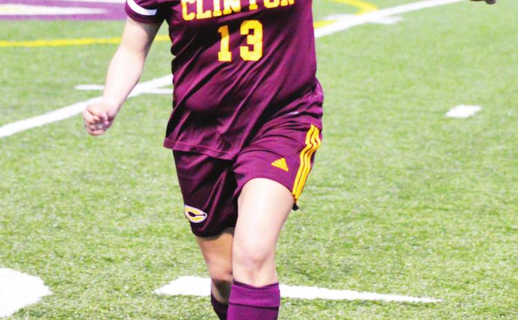 CDN | Collin Wieder Clinton senior defender Elizabeth Trejo dribbles the ball, before clearing it off the back line against Putnam City North.