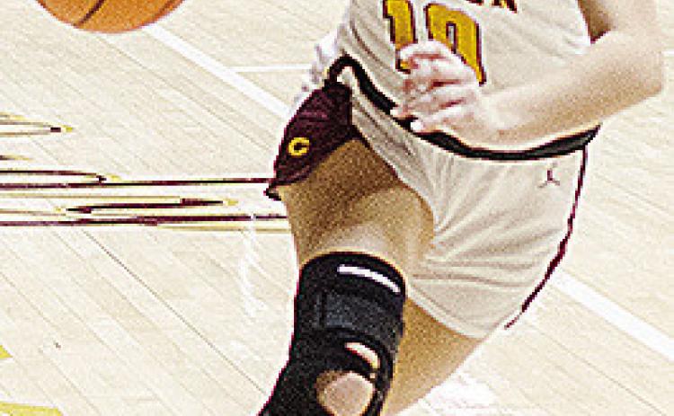 Clinton’s Hadley Meget drives the ball into the lane during the Lady Reds’ home game Saturday against Elk City. CDN | Sam Goodwyn