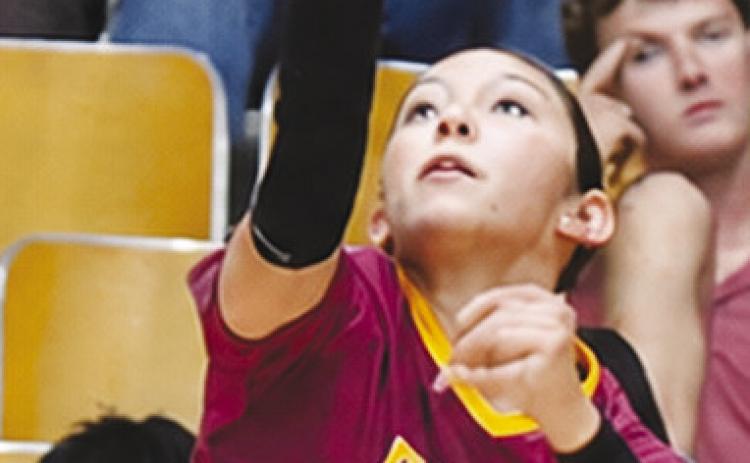Clinton’s Jocelyn Lagunas focuses as she serves the ball during the Lady Reds’ home win Thursday against Blair. CDN | Sam Goodwyn