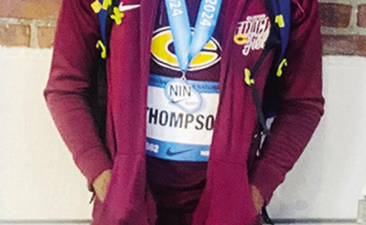 Thompson sets school record in long jump