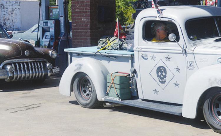 A line of vehicles, known as Rat Rods, stop to refill at the Phillips 66 on S. 10th Street. The trip was set to travel Route 66 from Goodsprings, Nev., to Langley, Ill., for “Rat Stock.” CDN | Christian Jacobsen