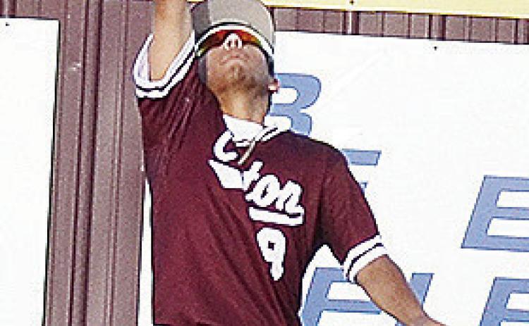 Clinton’s Azreal Fierros jumps up to make the catch during the Reds’ home win Tuesday over the neighboring Arapaho- Butler Indians to kick off the summer schedule. CDN | Sam Goodwyn
