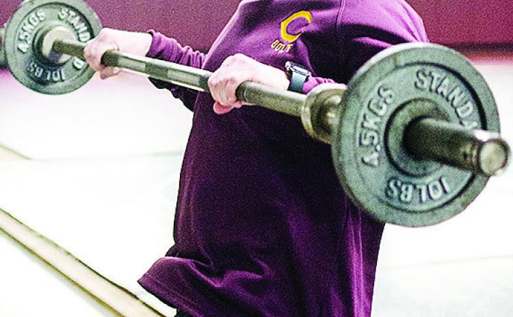 Clinton’s wrestling coach Rhett Blundell works out in the wrestling room over winter break. CDN | Sam Goodwyn
