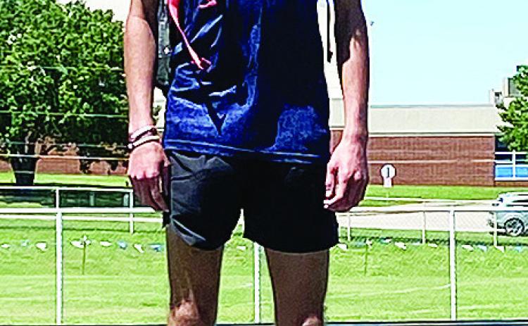 Clinton’s Xadrian Hernandez stands at the top of the standings for the 3,200-meter race Tuesday in the Meet of Champions in Stroud. CDN | Courtesy Photo