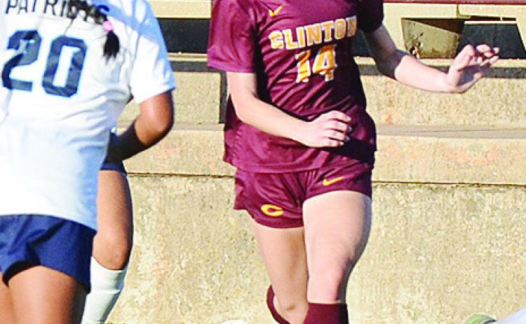 No. 14 Zoe Howell drives the ball toward a Putnam City West defender during Clinton’s home win over the Lady Patriots in the Tornado Bowl. CDN |Sam Goodwyn