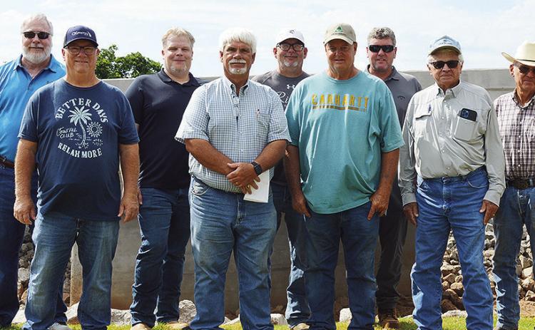 Front row from left, Buddy Vogt, Dist. 1 Commissioner Wade Anders, Davey Sewell, Terry Jones; back row, CED-7 Executive Director John Northup, Jeremy Andrews, Rodney Cabaniss, CED-7 Utilities Coordinator Clint Mahanay, and Jack Carpenter, stand in front o