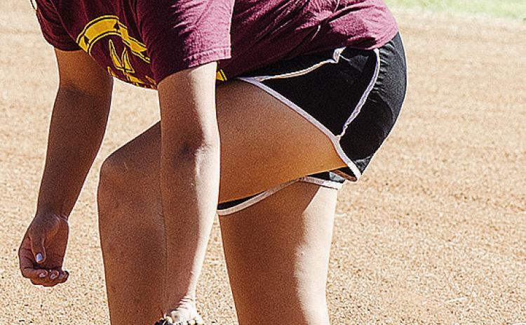 Clinton’s Jaeda Blackeagle fields the ball during preseason practice Tuesday at the softball field at the high school. CDN | Sam Goodwyn