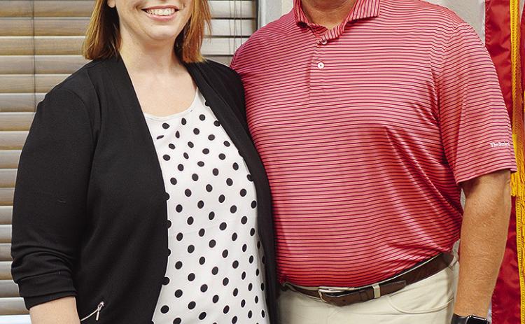 Newly-hired Asst. Supt. Melissa Knabe, left, and Supt. Nathan Meget pose for a photo after she was approved Monday for the position. CDN | Micah Ashcraft
