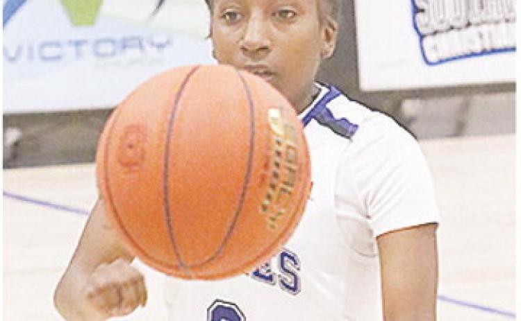 Former Clinton Lady Red Carmella Jefferson passes the ball during a game for Southwestern Christian University this season. CDN | Courtesy photo