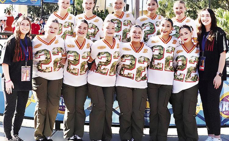 The Clinton High School dance team poses for a team photo while down in Orlando, Fla., competing at the National High School Dance Competition last weekend. Pictured, from left, in front are Coach Payten Childers, Lyssa Day, Tatum Shackelford, Stella Meac