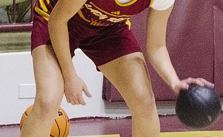 Clinton’s Paisley Ruyle practices her dribbling skills during practice Wednesday in the Tornado Dome. CDN | Sam Goodwyn