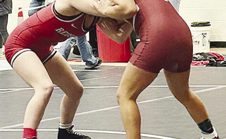Clinton’s Angelina Ramirez, right, grapples with her opponent during the Class 5A girls’ wrestling tournament Monday in Cache. CDN | Courtesy Photo