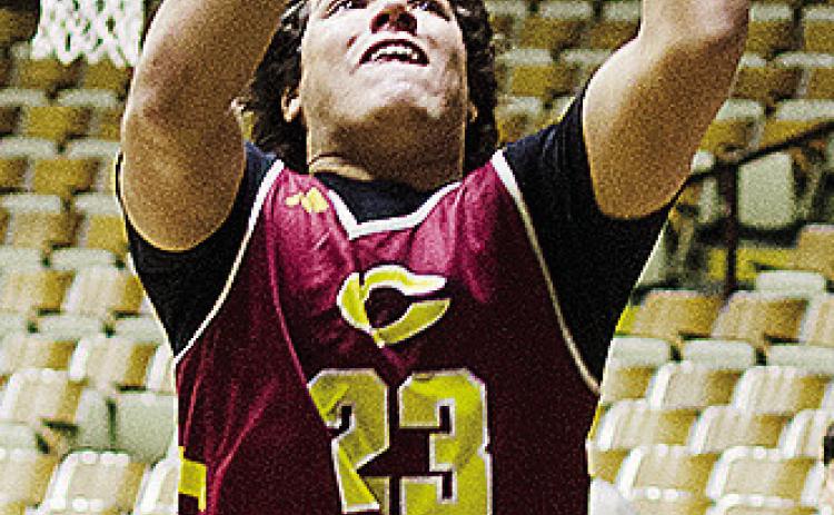 Clinton’s Easten Powell goes up for the layup during a basketball practice at the Tornado Dome. CDN | Sam Goodwyn