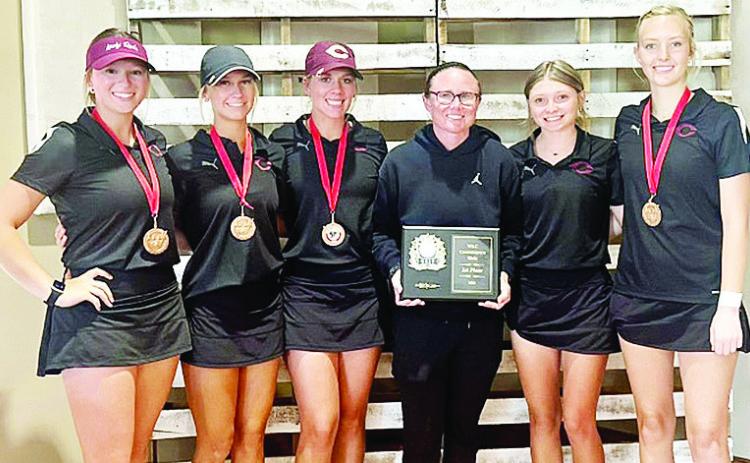 The Clinton Lady Reds golf team finished first in the Western Conference Tournament in Weatherford. Pictured, from left, are Paige Pugh, Addison Newcomb, Grace Meacham, Coach Tasha Marshall, Rylee Cummins and Addyson Littke. CDN | Courtesy photo