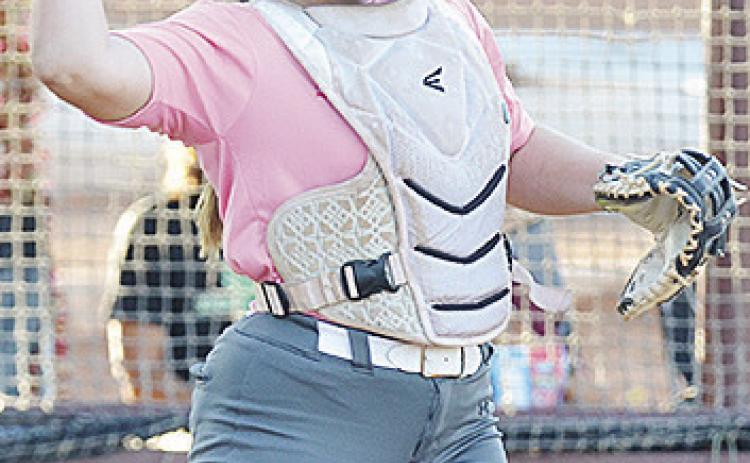Rhylee Rodebush throws the ball back to the pitcher during Clinton’s home game Thursday. CDN | Sam Goodwyn