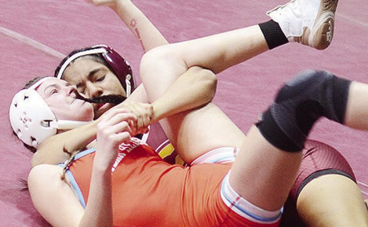 Clinton’s Aaliyah Arredondo manages to pin her Western Heights opponent during the Hub City Wrestling Tournament Friday at the Tornado Dome. CDN | Sam Goodwyn