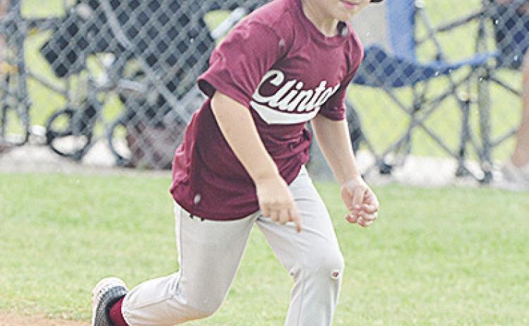 Clinton’s Timmy Sorter hustles out of the box toward first during the Maroons’ game against Altus. CDN | Sam Goodwyn
