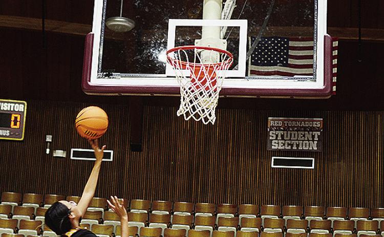 Freshman Rhianna Ellis lays the ball up and beats the newly installed shot clock during an offseason workout Wednesday in the Tornado Dome. CDN | Sam Goodwyn
