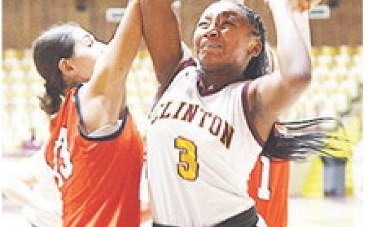 Clinton’s Arlena Kirkendoll fights through a Lindsay defender during the Lady Reds’ game against the Leopardettes at the Tornado Dome. CDN |Sam Goodwyn