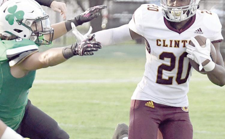 Stiff-arming a defender