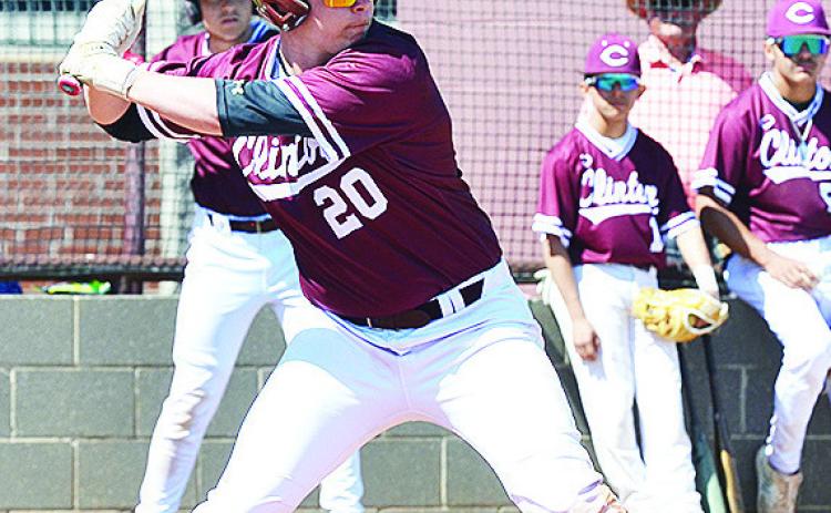 Clinton’s Brady Chittum tenses up as he prepares for the pitch in his at bat during the Reds’ home game against Bishop McGuiness. CDN | Sam Goodwyn