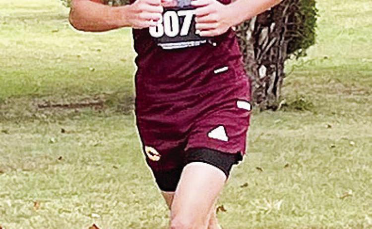 Parker Turney runs the course during the regional meet Saturday. CDN | Courtesy photo