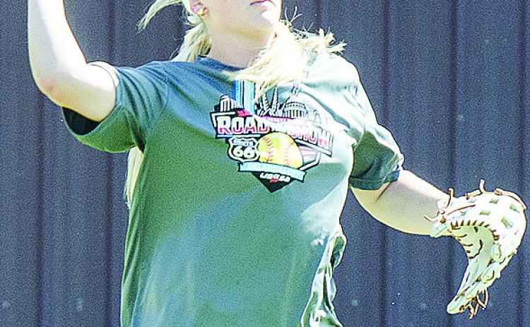 Clinton’s Rhylee Rodebush prepares to throw the ball during softball practice at the high school. CDN | Sam Goodwyn