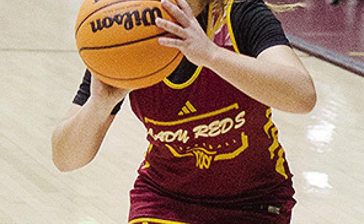 Clinton’s Laney Anderson gets into her stance as she prepares to shoot the ball during practice. CDN | Sam Goodwyn