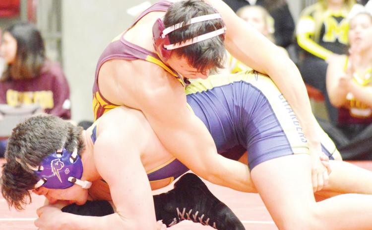 Mitchell wrestles some, preserves redshirt