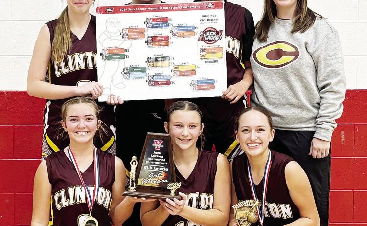 The Clinton Middle School eighth-grade team is all smiles after taking home the championship during the recent Jack Lackey Memorial Basketball Tournament in Yukon. Pictured in front, from left, are Laney Anderson, Hadley Meget, and Paisley Ruyle; back, Ma