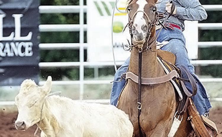 Rebekah Davis ropes a calf during last year’s Clinton Rodeo at the Clinton Round-Up Club Arena. CDN | Sam Goodwyn
