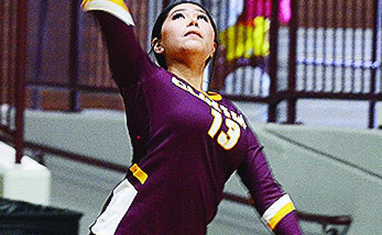 Clinton’s Danna Mendieta serves the ball during the Lady Reds’ home match against Blair Tuesday in the Tornado Dome. CDN | Sam Goodwyn