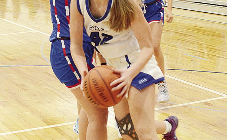 Corn Bible’s Audrey Stewart drives by a Bray-Doyle defender during the Lady Crusaders’ home game against the Lady Donkeys. CDN | Sam Goodwyn