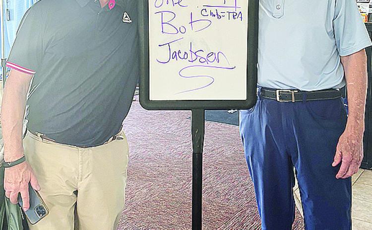 Bob Jacobson, left, smiles with Riverside Golf Pro Perry Adams after hitting a hole-in-one on hole No. 17 at Riverside Golf Course. CDN | Courtesy photo