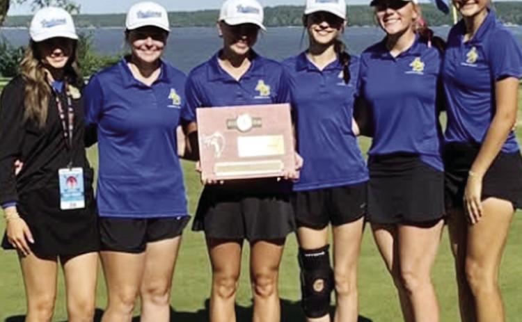 The Arapaho-Butler Lady Indians recently won the regional championship at The Coves in Afton to qualify for the Class 2A State Tournament. From left are Assistant Coach Lilly Roush, Malley Baker, eighth place (104); Elisa Vels, second place (85); Tinley M