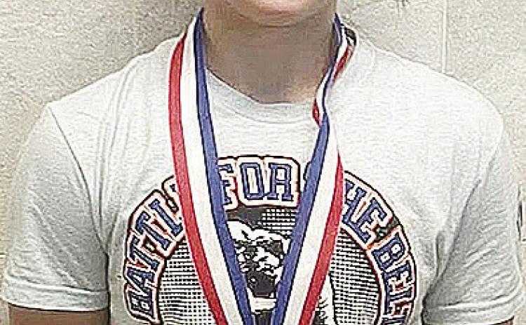Clinton’s Kalley Fuller smiles after she finished fourth at the Junior High State Wrestling last week at the OG&amp;E Coliseum in Oklahoma City. CDN | Courtesy Photo