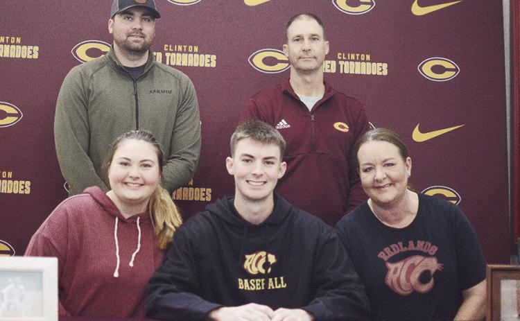 Clinton’s Craig Hunter, center, celebrates with his family after signing to play college baseball with Redlands Community College in El Reno. Pictured in front, from left, are his sister Blair, Hunter, his mom Amy; back, his brother Patrick and dad Aaro