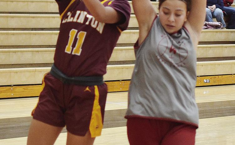 Clinton’s AJ Spottedwolf lays the ball up over a defender during the JV road game Monday against Weatherford. CDN | Sam Goodwyn