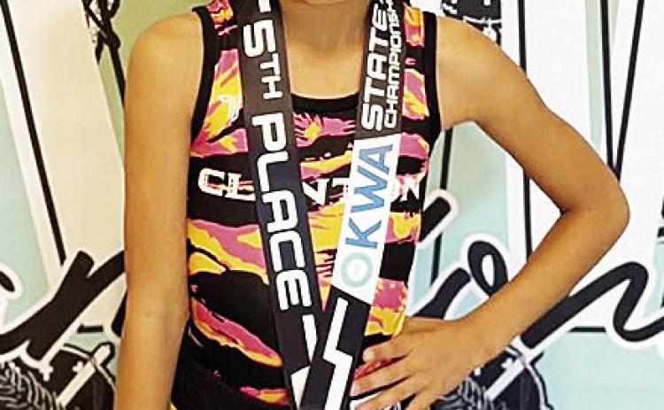 Adelynn Lonebear smiles after finishing fifth in the 8U 47-pound class during the OKWA State Wrestling Tournament in Oklahoma City over the weekend. CDN |Courtesy Photo