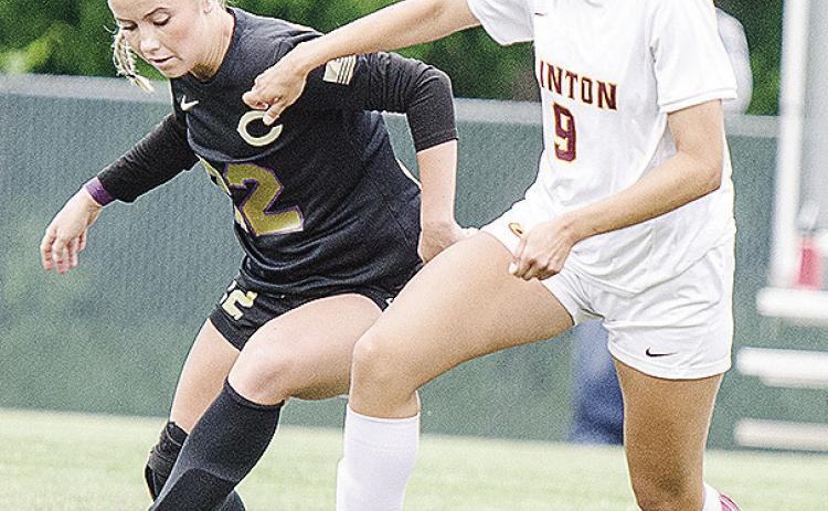 No. 9 Maddi McAtee, right, fights against the Chickasha defender during Clinton’s road win over the Lady Chicks Thursday in the first round of the playoffs. CDN | Sam Goodwyn