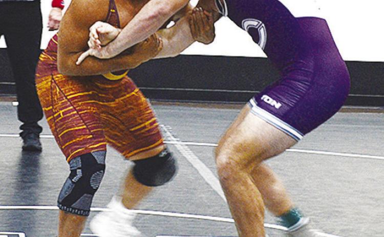 Clinton’s Malachi Lorne, left, grapples with his opponent during the first day of the Max Dipple Memorial Wrestling Tournament in Weatherford over the weekend. CDN | Sam Goodwyn