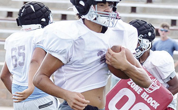 JJ Ruiz carries the ball during a drill during practice in the Tornado Bowl. CDN | Sam Goodwyn